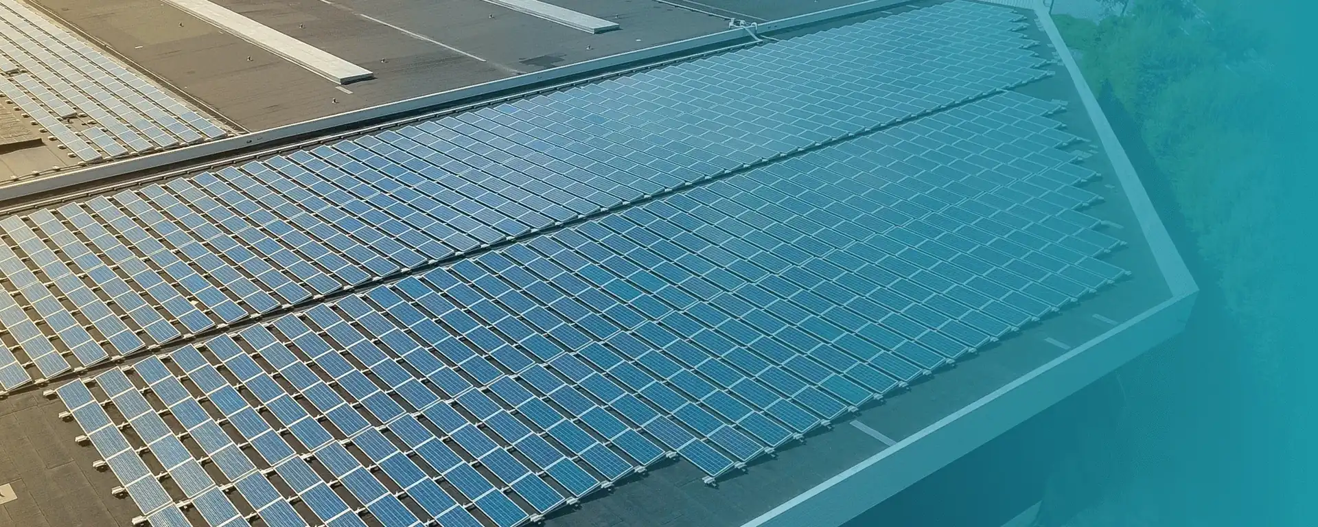 Aerial view of a large commercial rooftop solar installation
